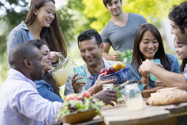 Adults and children eating — Stock Photo
