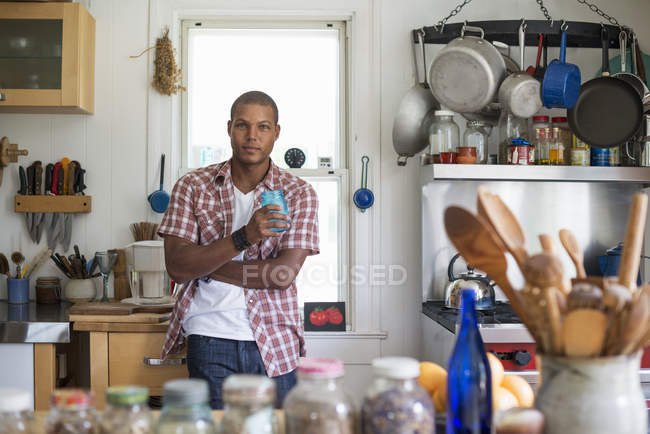 Man in a farmhouse kitchen. — Stock Photo