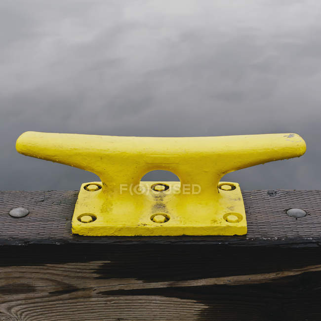 Large yellow mooring cleat — Stock Photo