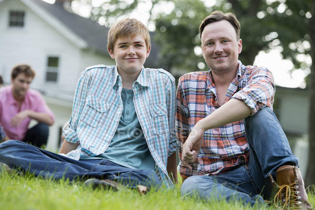 Father and son at a summer party — Stock Photo
