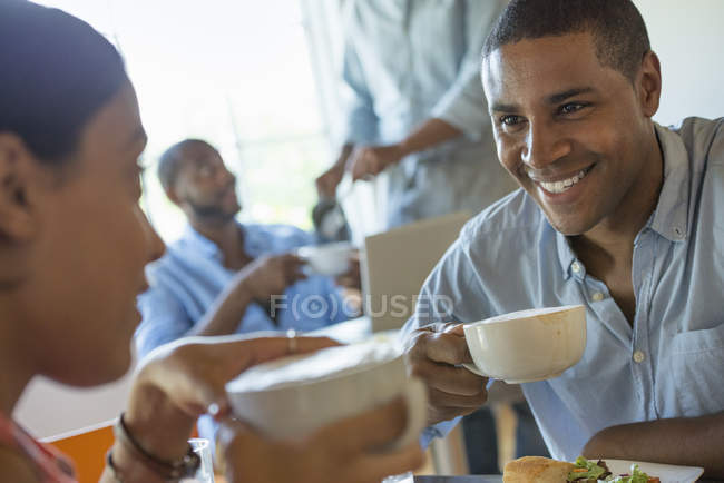 Men and women in a cafe having drinks — Stock Photo