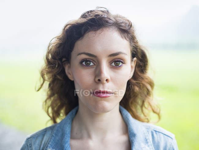 Woman with windblown curly hair. — Stock Photo