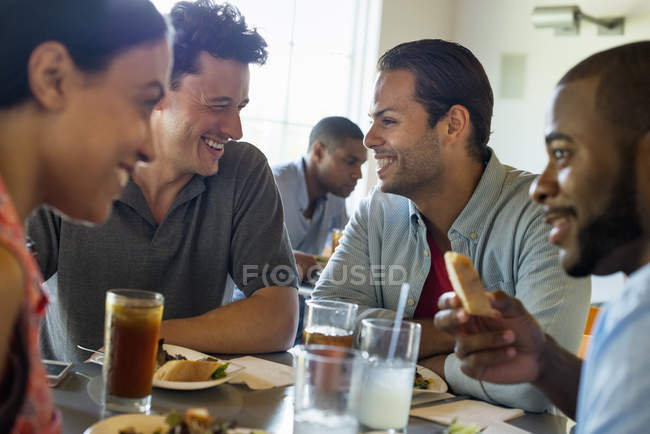 Men and woman in cafe — Stock Photo