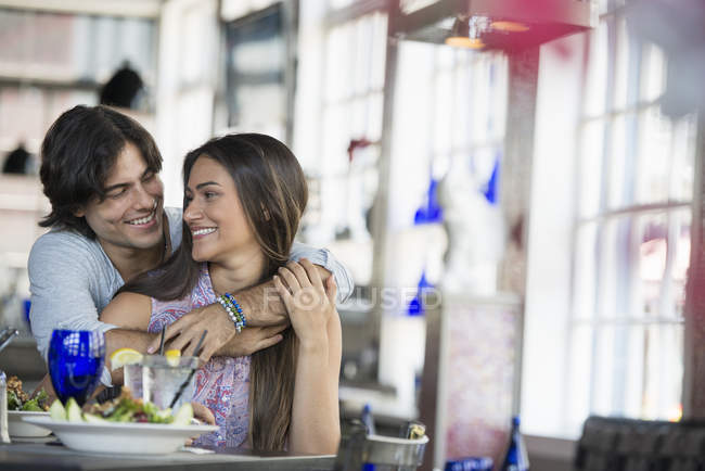 Couple seated in restaurant — Stock Photo