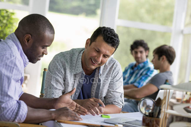 Two men working together. — Stock Photo