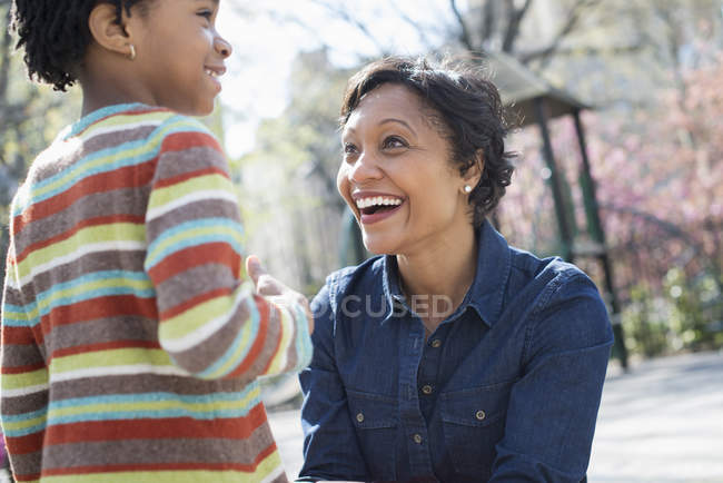 Mother kneeling down at her son — Stock Photo