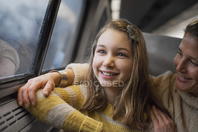 Woman and young girl in train — Stock Photo
