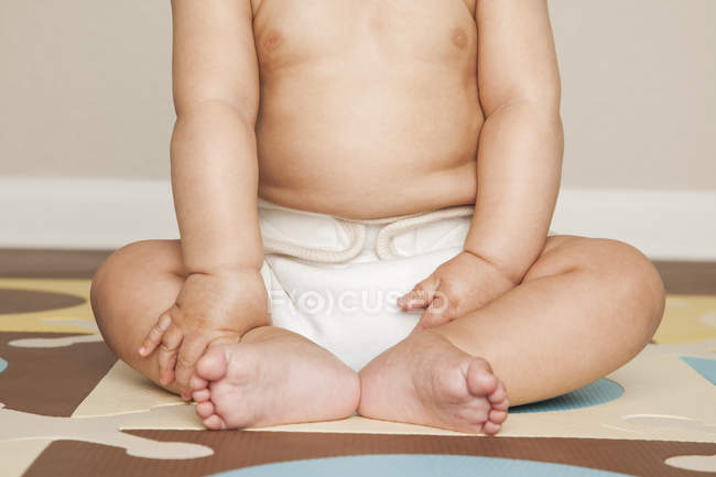 Baby boy wearing cloth diapers — Stock Photo
