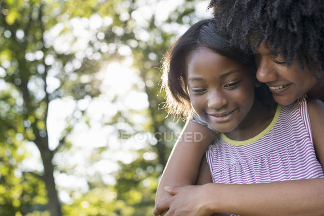 Woman and a child hugging. — Stock Photo