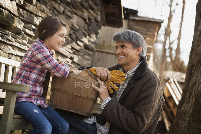 Man and a child on an organic farm. — Stock Photo