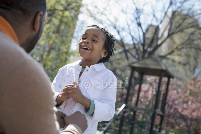 Father buttoning his son's jacket — Stock Photo