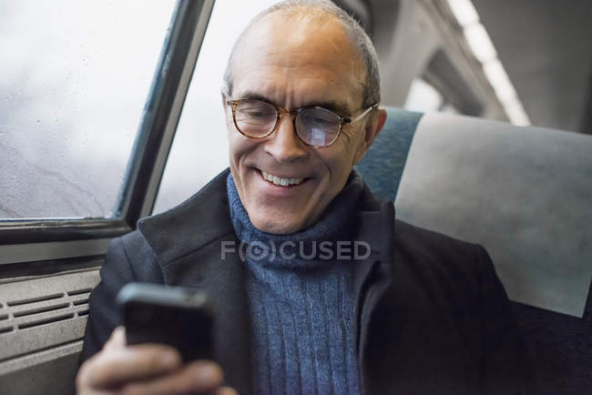 Mature man in train — Stock Photo