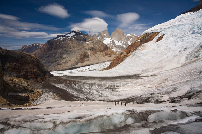 Several hikers on glacier — Stock Photo