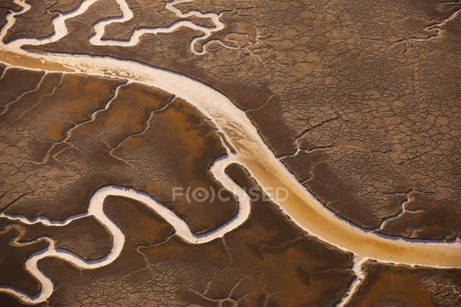 Salt flats with glistening water channels — Stock Photo