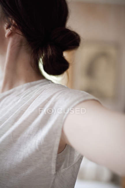Woman wearing a light tee shirt — Stock Photo