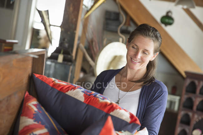 Woman in an antique store — Stock Photo