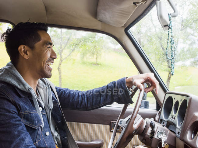 Young man in a car — Stock Photo