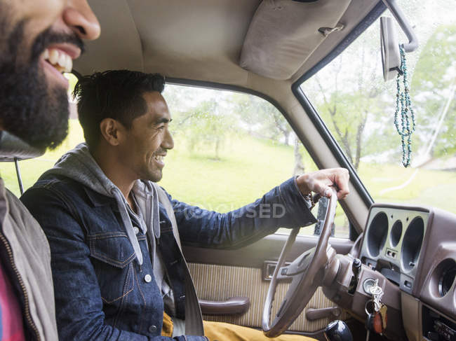 Two young men in a car — Stock Photo