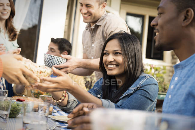 Friends around a table — Stock Photo