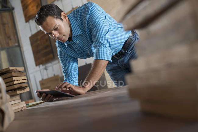 Young man in workshop — Stock Photo