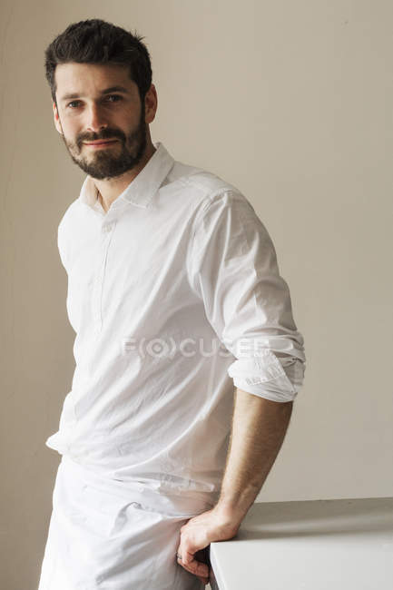 Bearded Baker man wearing a apron — Stock Photo