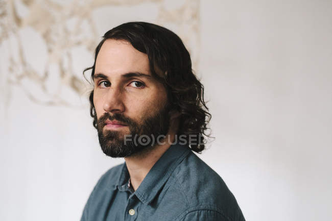 Male artist with an art piece — Stock Photo
