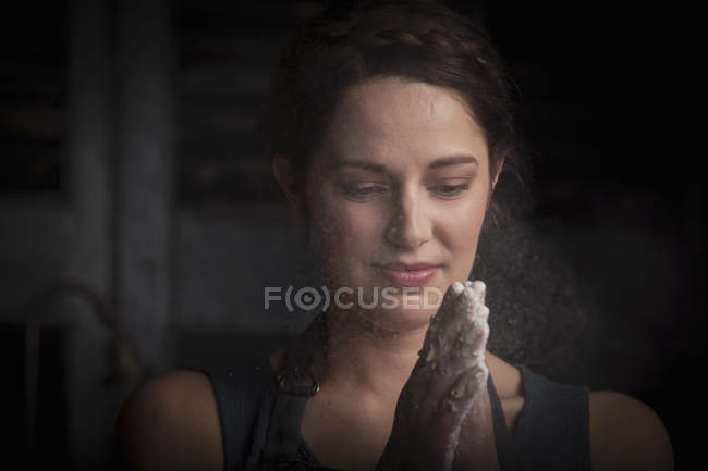 Woman with dough on hands — Stock Photo