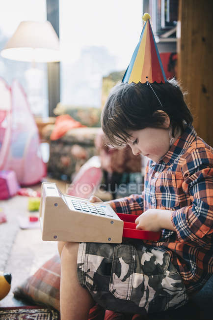 Boy unwrapping presents — Stock Photo