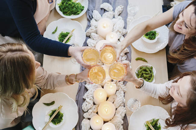 Overhead view of people sharing a meal — Stock Photo