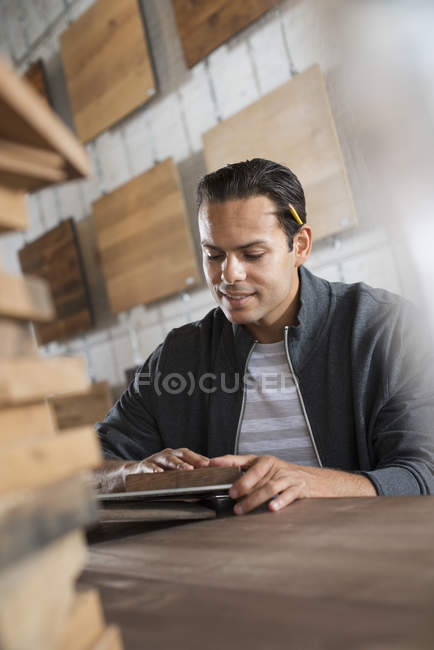 Young man in workshop — Stock Photo