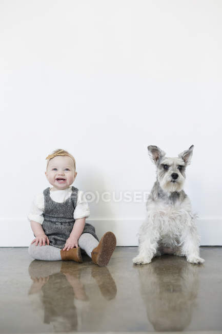 Small girl and a dog — Stock Photo