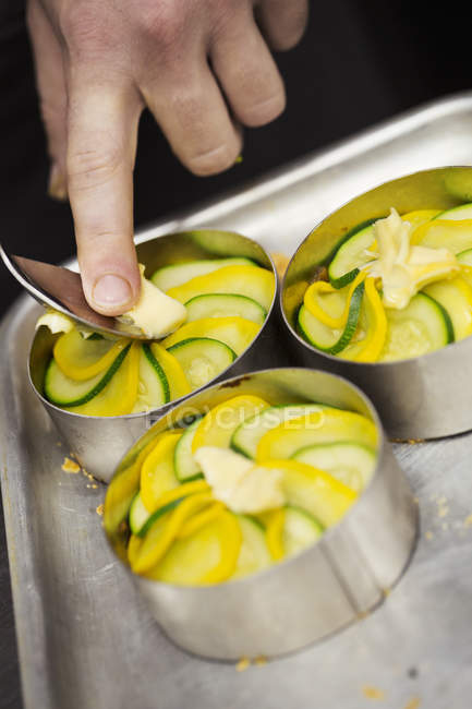 Chef preparing three dishes — Stock Photo
