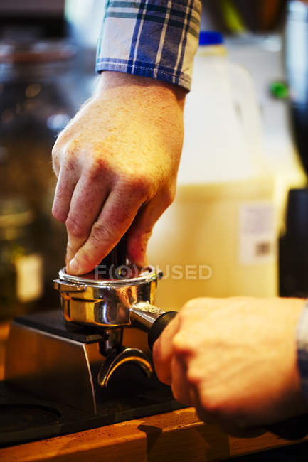 Barista making cup of espresso — Stock Photo