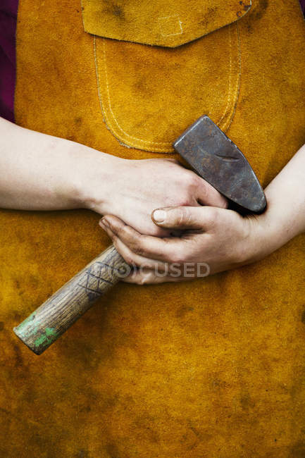 Man holding a mallet. — Stock Photo
