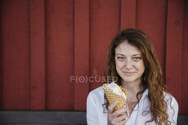 Woman eating ice cream. — Stock Photo