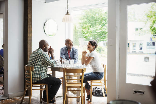 Men and woman having lunch in cafe — Stock Photo