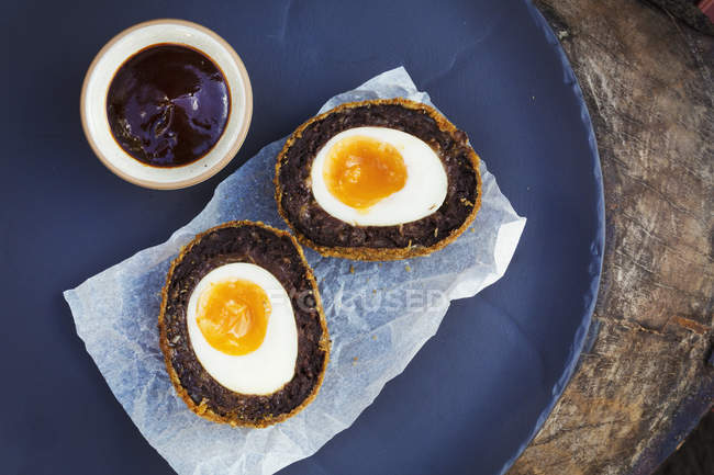 Dish with fresh made scotch egg — Stock Photo