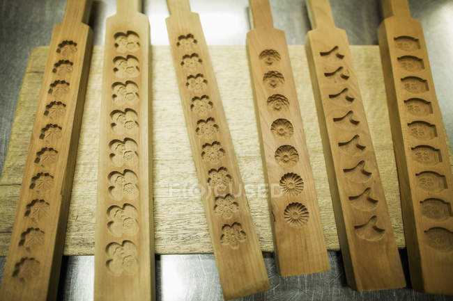 Shelves of wooden moulds for wagashi — Stock Photo