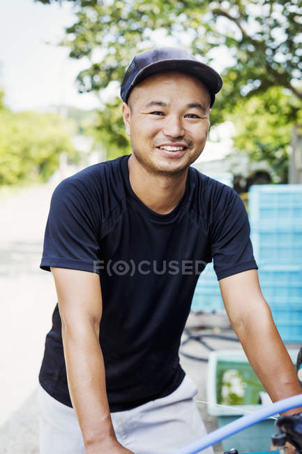 Young man working on a farm — Stock Photo