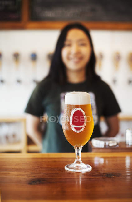 Beer glass standing on a counter — Stock Photo