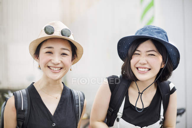 Young women wearing hats. — Stock Photo