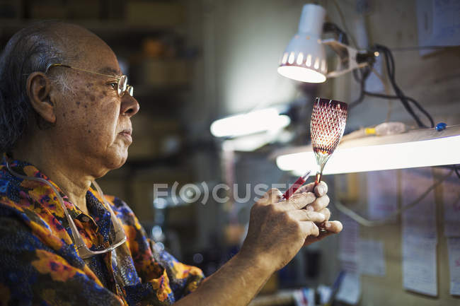 Senior craftsman at work — Stock Photo