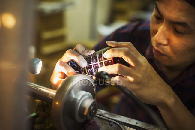 Craftsman at work at a machine — Stock Photo