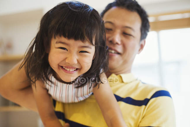 Man holding his young daughter. — Stock Photo
