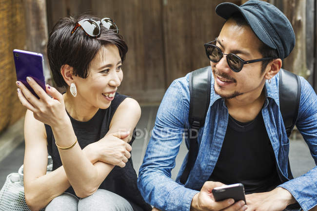 Couple seated side by side — Stock Photo