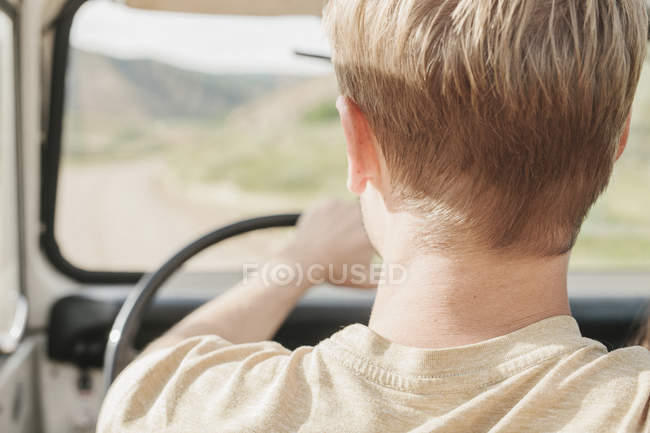 Man driving open top jeep. — Stock Photo