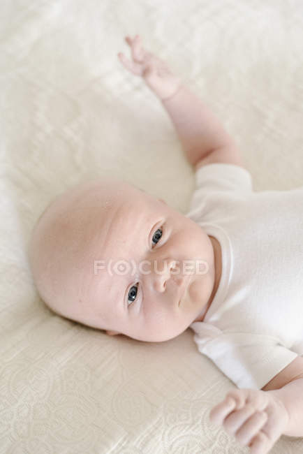 Baby boy lying on his back — Stock Photo