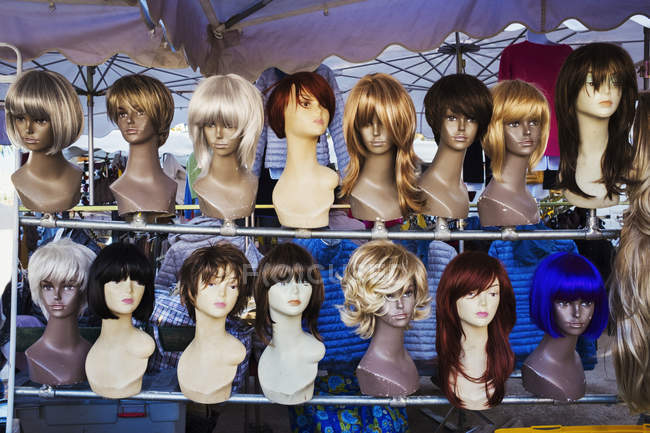 Mannequin heads and display of wigs — Stock Photo
