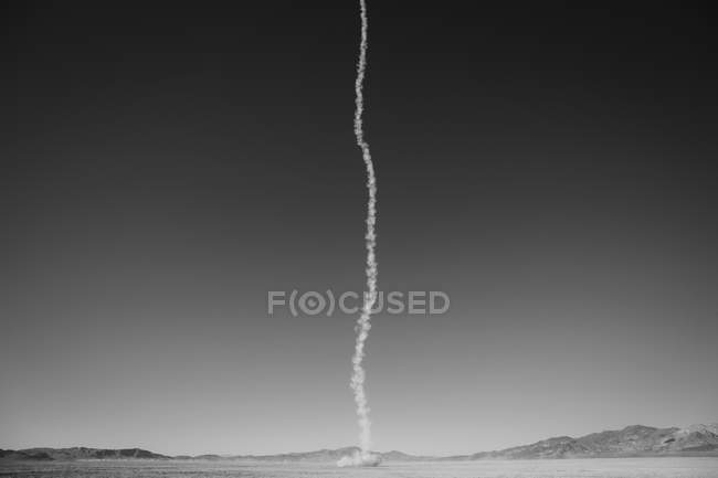 Smoke trail from rocket shooting — Stock Photo