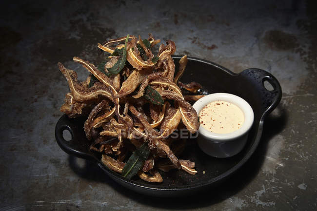 Iron skillet with tempura — Stock Photo